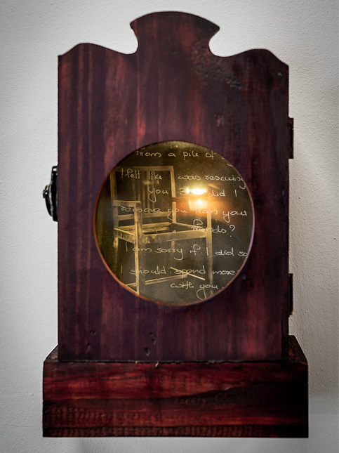 Wooden Display with Handwritten Text and Chair Reflection – Beautiful Homes