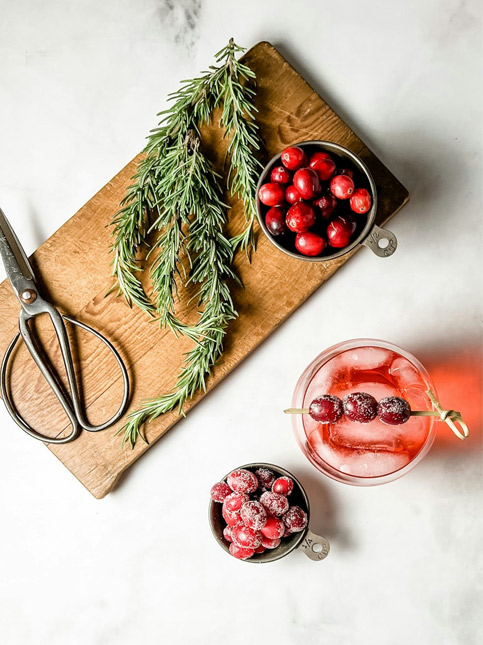 Festive rosemary and cranberry drink styling with scissors and wooden board – Beautiful Homes