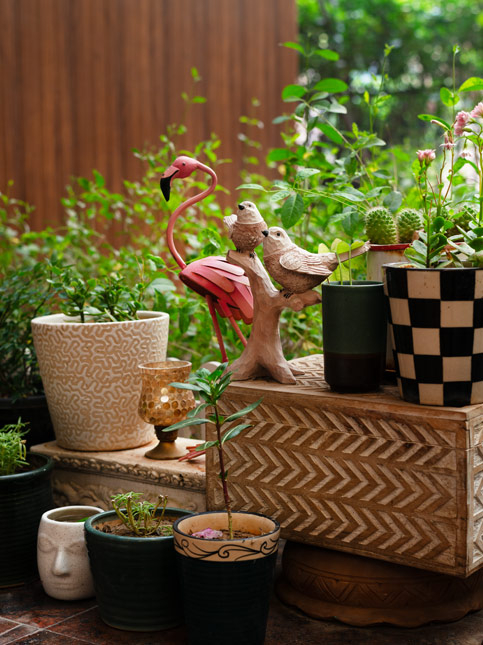 Curated home interior with souvenirs and greenery – Beautiful Homes