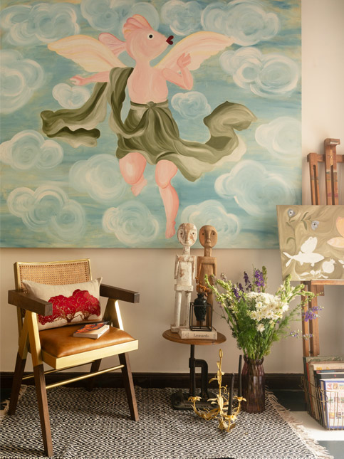 Divine Wilderness artwork with side table and wooden sculptures from Banjara Market – Beautiful Homes