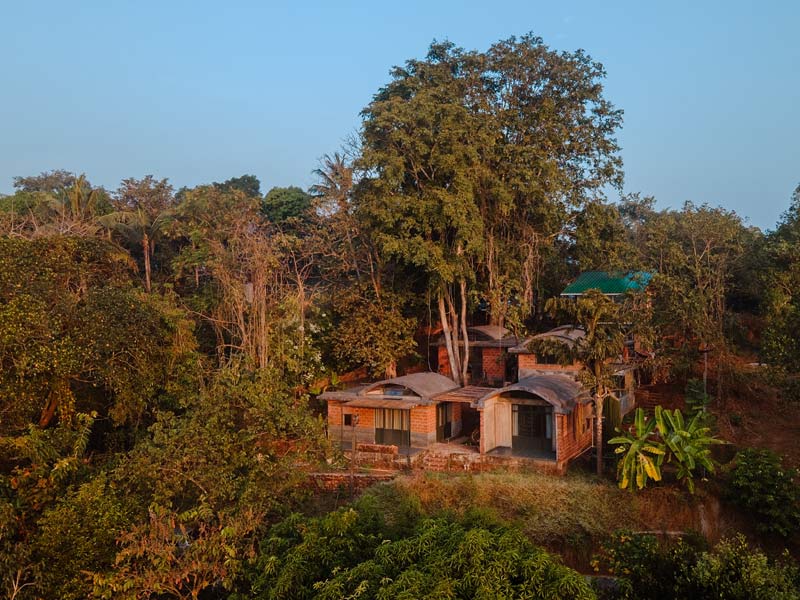 The home and studio are built into the natural slope of the hillside, carefully positioned to preserve existing trees – including a large Indian elm that the couple fell in love with at first sight – Beautiful Homes