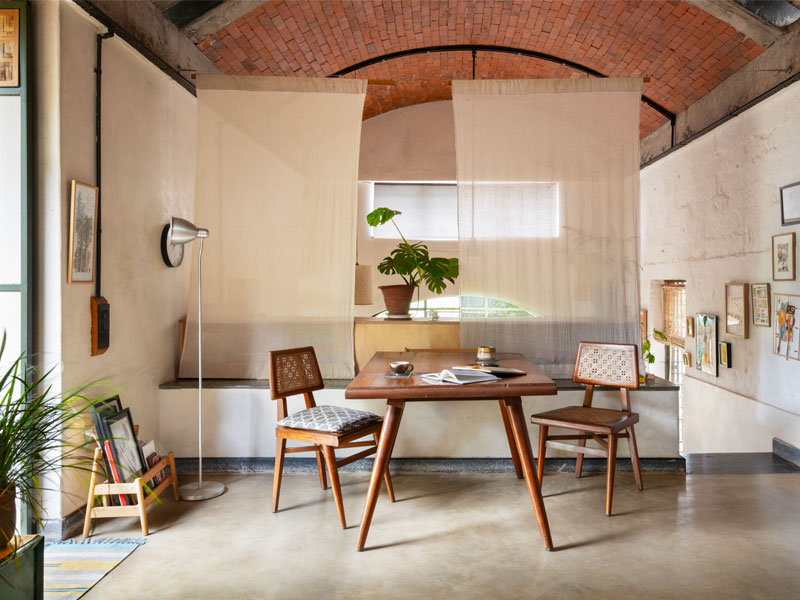 The living area sits directly above the couple’s bedroom and is intentionally sparse, with movable furniture and cloth screens that offer flexibility and privacy without interrupting the open plan – Beautiful Homes