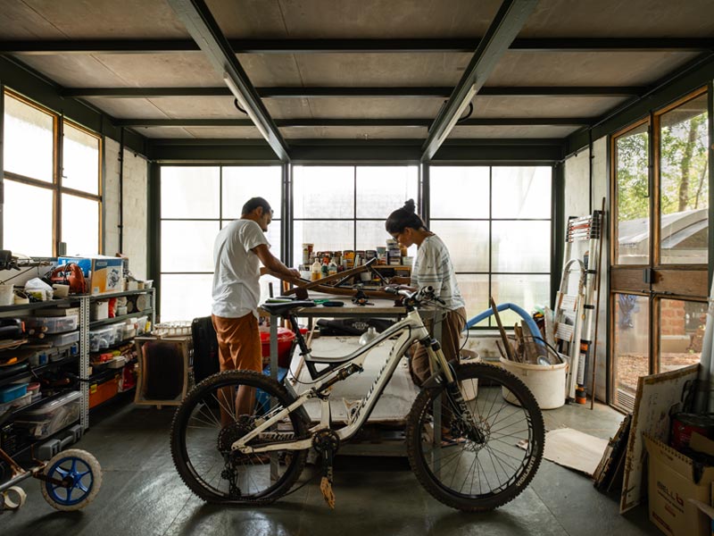 The ground floor of the studio houses a sunlit workshop, where Anindya Roy prototypes furniture and repairs bicycles and the family tinkers with tools, parts, and playful ideas– Beautiful Homes