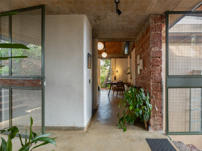 The main entrance opens into a transitional zone that connects the kitchen and living areas. It’s where groceries are brought in and it also houses storage and a powder room tucked between the two core wings of the home – Beautiful Homes