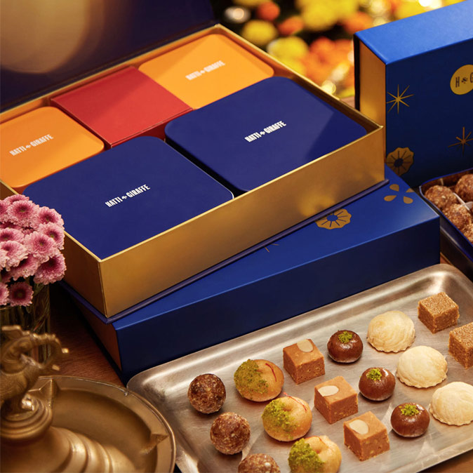 Colourful Diwali sweet boxes filled with a variety of Indian sweets - Beautiful Homes