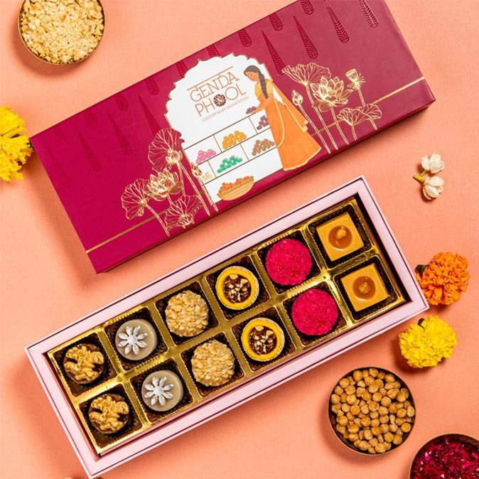 Beautifully designed Genda Phool sweet box featuring traditional Indian sweets - Beautiful Homes