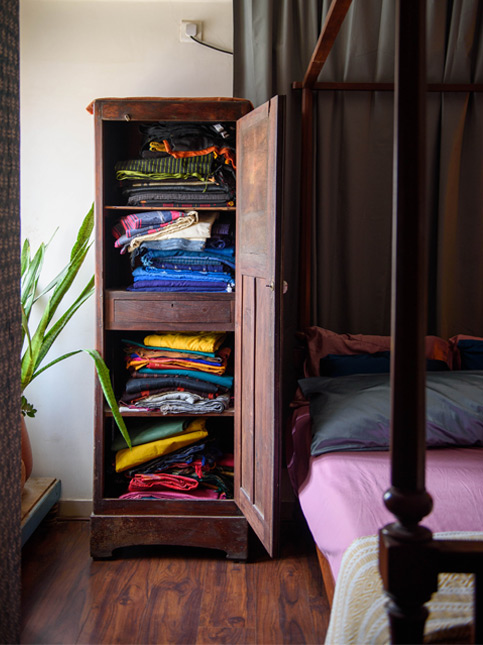 Indu Antony airing and folding saris in cupboard – Beautiful Homes