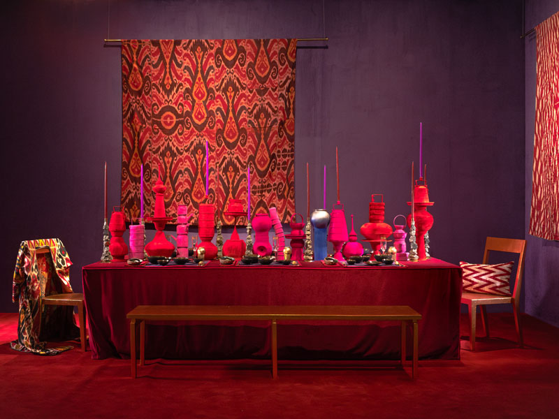 Vivid Dream by Eeshaan Kashyap is a lush tablescape saturated in red and features sculptural pieces in velvet, pyrite candlestands, and ikat fabric to create a vivid tableau – Beautiful Homes