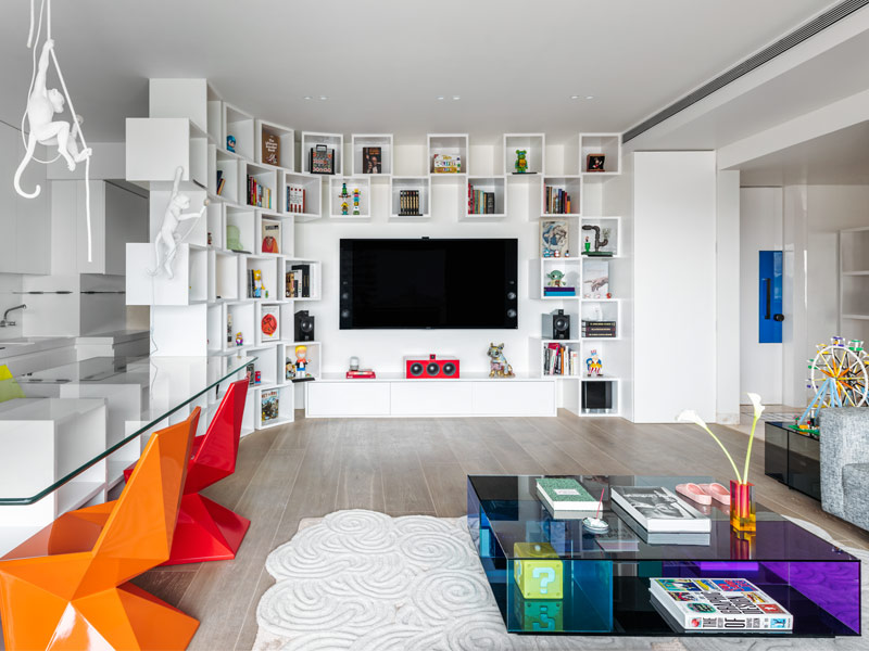 Sleek white unit as dining base, storage and divider by Jannat Vasi Interior Design – Beautiful Homes