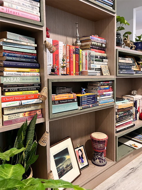 Non-fiction collection on custom staircase bookshelf – Beautiful Homes