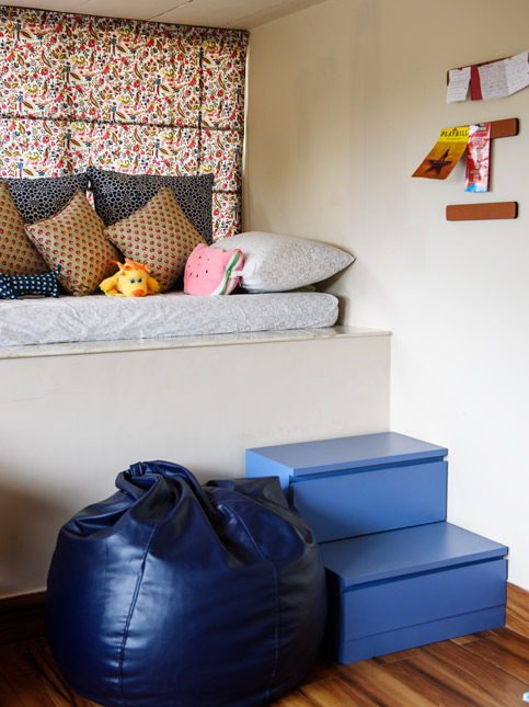 Cozy window seating with colourful cushions, playful pillows, and a blue bean bag – Beautiful Homes