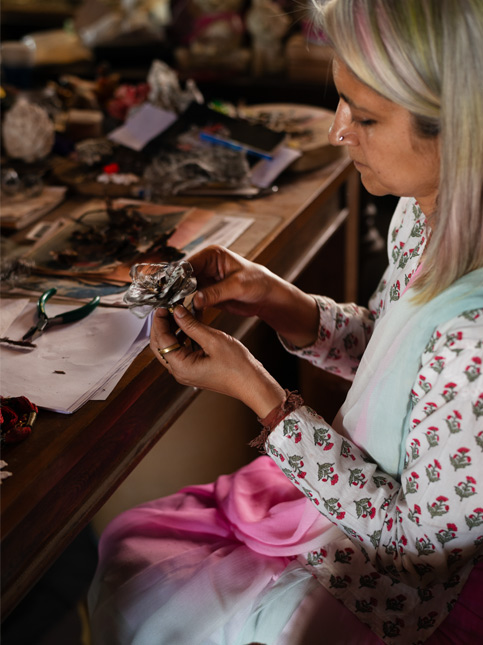 Artist Ritu Singh at her studio desk - Beautiful Homes