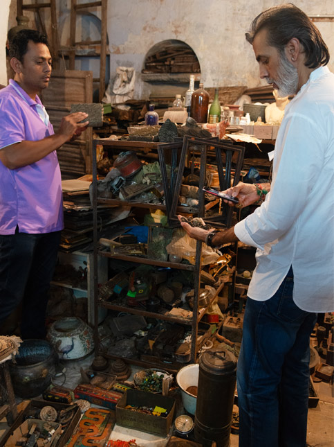 Surya Singh selecting objects at Asif’s storeroom - Beautiful Homes