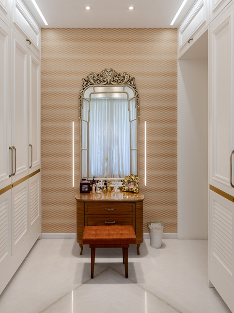 The customised ‘wardrobe-for-her’ with an ornate mirror, dresser and pouffe completes the personalised dressing space – Beautiful Homes