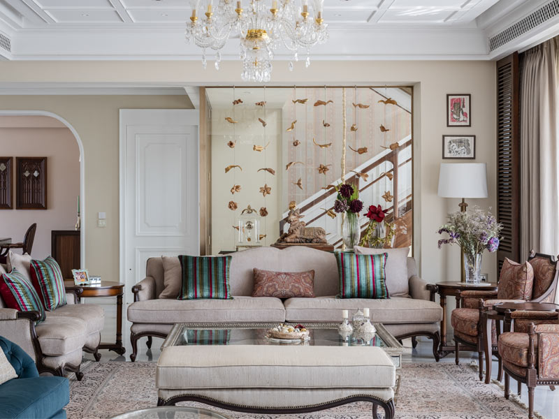 The living space is layered and furnished with neutrals to blend with the rest of the space - Beautiful Homes