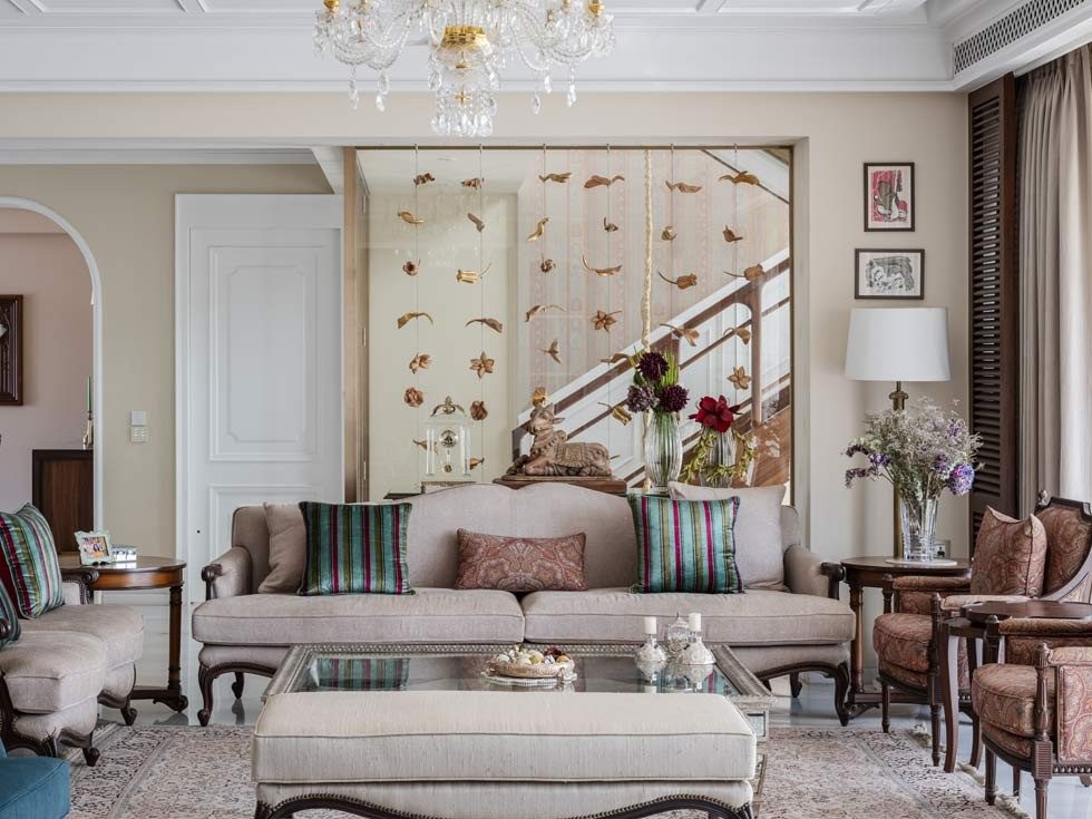 The living space is layered and furnished with neutrals to blend with the rest of the space - Beautiful Homes