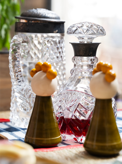 Etikoppaka dolls add a playful note to the table, sitting lightly against the sparkle of cut glass – Beautiful Homes