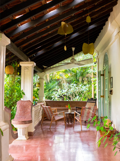 Entrance with tiled roof and Portuguese-style details – Beautiful Homes