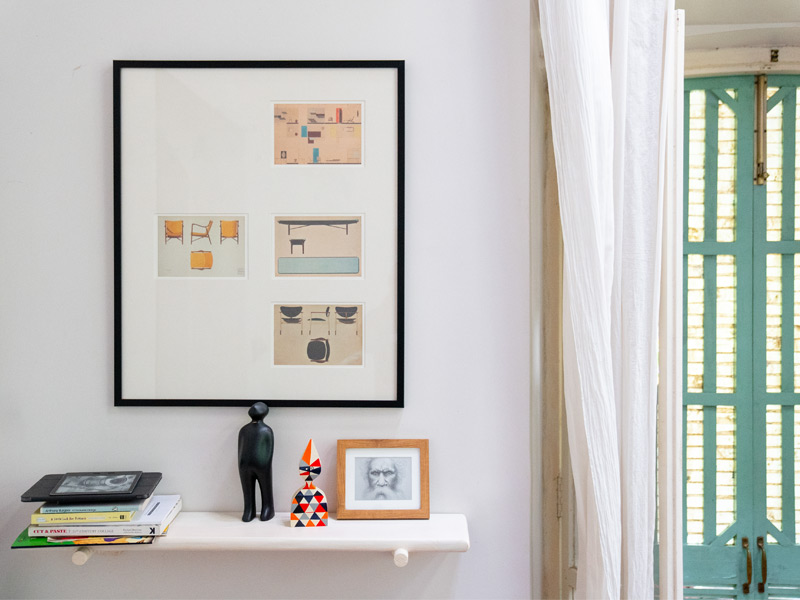 Wall showcasing evolving chair designs – Beautiful Homes