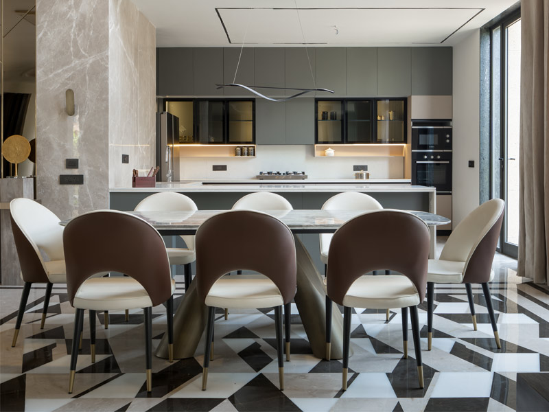 Dining space with monochrome flooring – Beautiful Homes