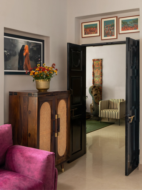 Den with wine sofa & patterned rug – Beautiful Homes