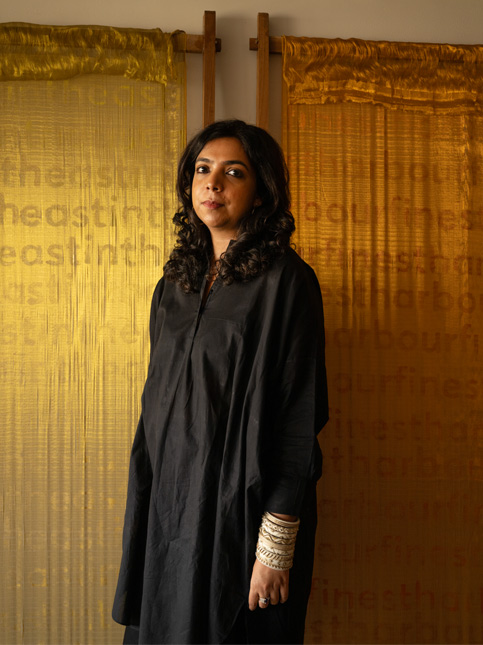 Lakshmi in her studio with her framed Kasavu works – Beautiful Homes