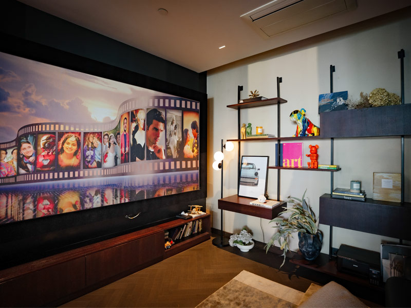 Den with film-strip mural – Beautiful Homes