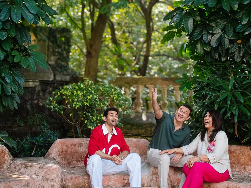 Family relaxing in garden – Beautiful Homes