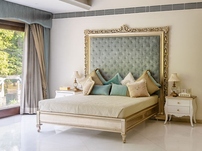 Ivory master bedroom with carved furniture – Beautiful Homes