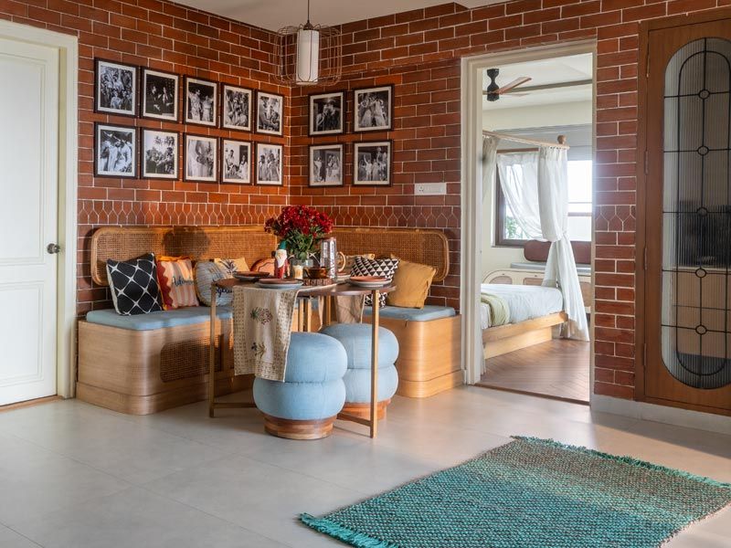 Brick wall dining nook with wedding photos – Beautiful Homes