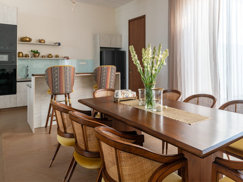 Dining area with wooden eight-seater table – Beautiful Homes