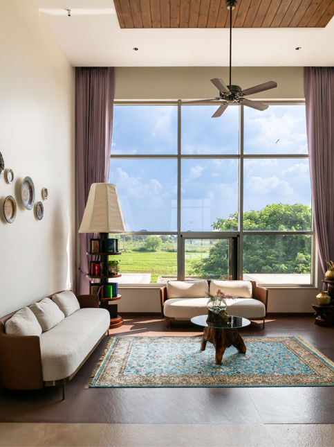 Family living room with woven rugs and timber ceiling – Beautiful Homes