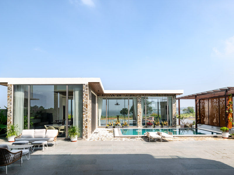 Poolside stone decks with glazing and lake views – Beautiful Homes