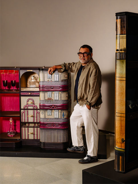 Designer posing with bar cabinet inspired by Sea View Mahal on Marine Drive – Beautiful Homes