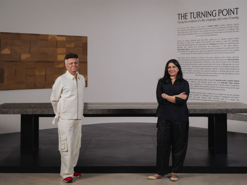 Two people standing in gallery exhibition space - Beautiful Homes