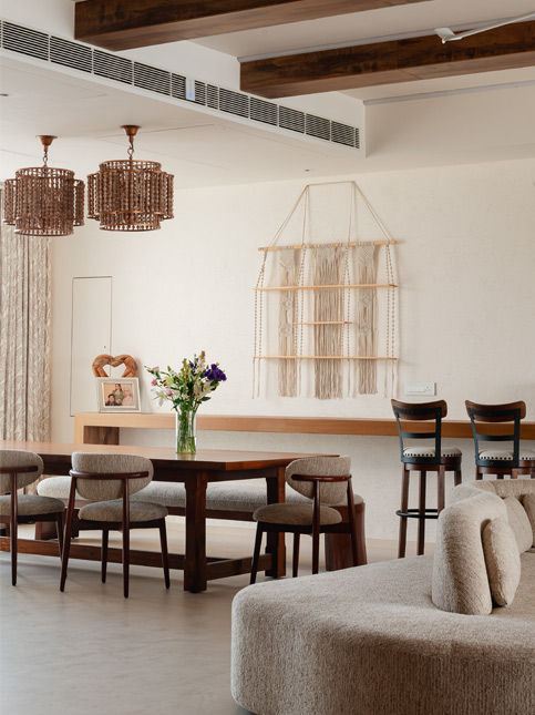 Long dining table defining dining zone – Beautiful Homes