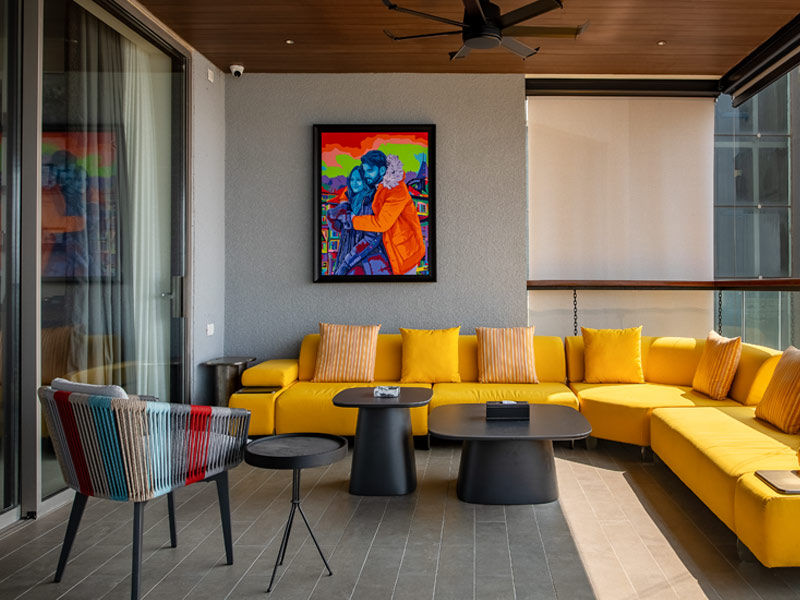 Terrace with pop art and yellow modular sofa – Beautiful Homes