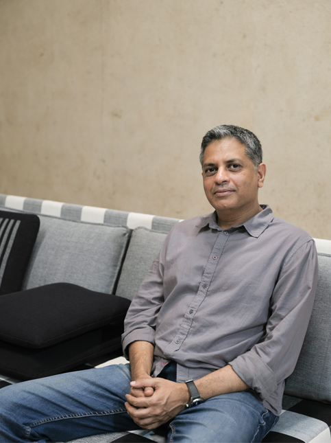 Co-founder Deepak Srinath sits on the newly launched No. 11 Sofa from the Geoffrey Bawa Collection – Beautiful Homes