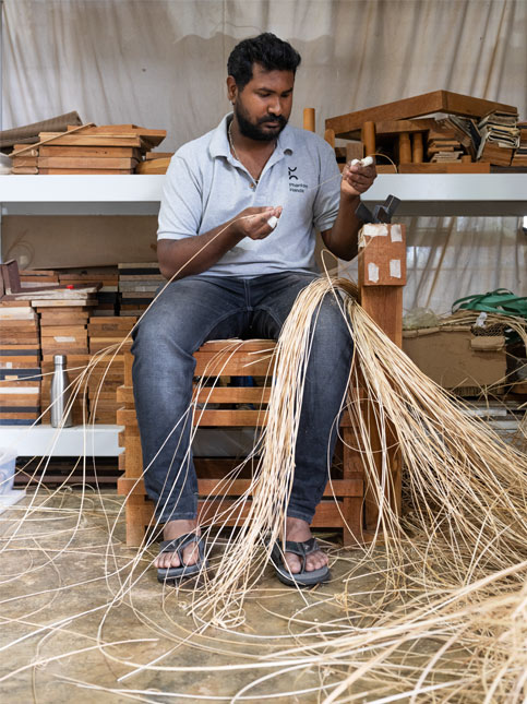 Gilbert Raju prepares cane strands, precisely sized for distinct weave patterns – Beautiful Homes