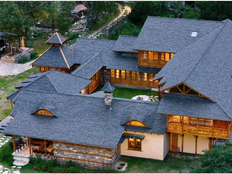 Aerial view of a rustic mountain villa with a central courtyard– Beautiful Homes