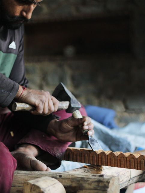 During NORTH’s fieldwork, woodcarvers shape intricate forms with steady, inherited skill. Each notch and curve holds cosmology, memory, and structural purpose – Beautiful Homes