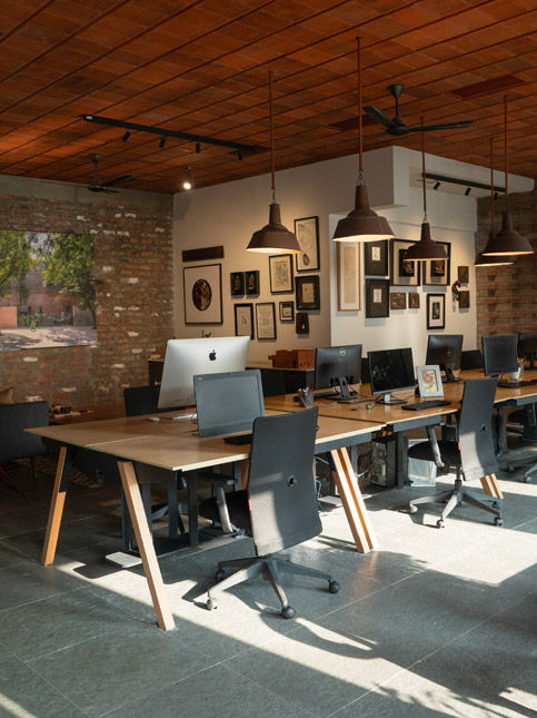 Custom worktables running through studio – Beautiful Homes