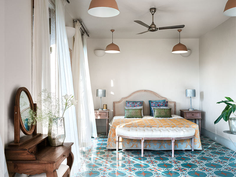 The Japanese postcard artwork on the wall along with the bespoke floor lamp are sourced from The Flame Store, Goa – Beautiful Homes