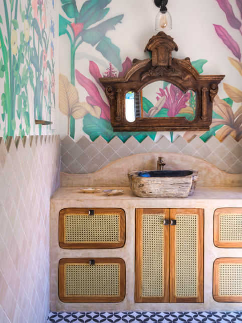 The powder room in one of Studio MoMo’s projects features locally sourced stone used as dado cladding – Beautiful Homes