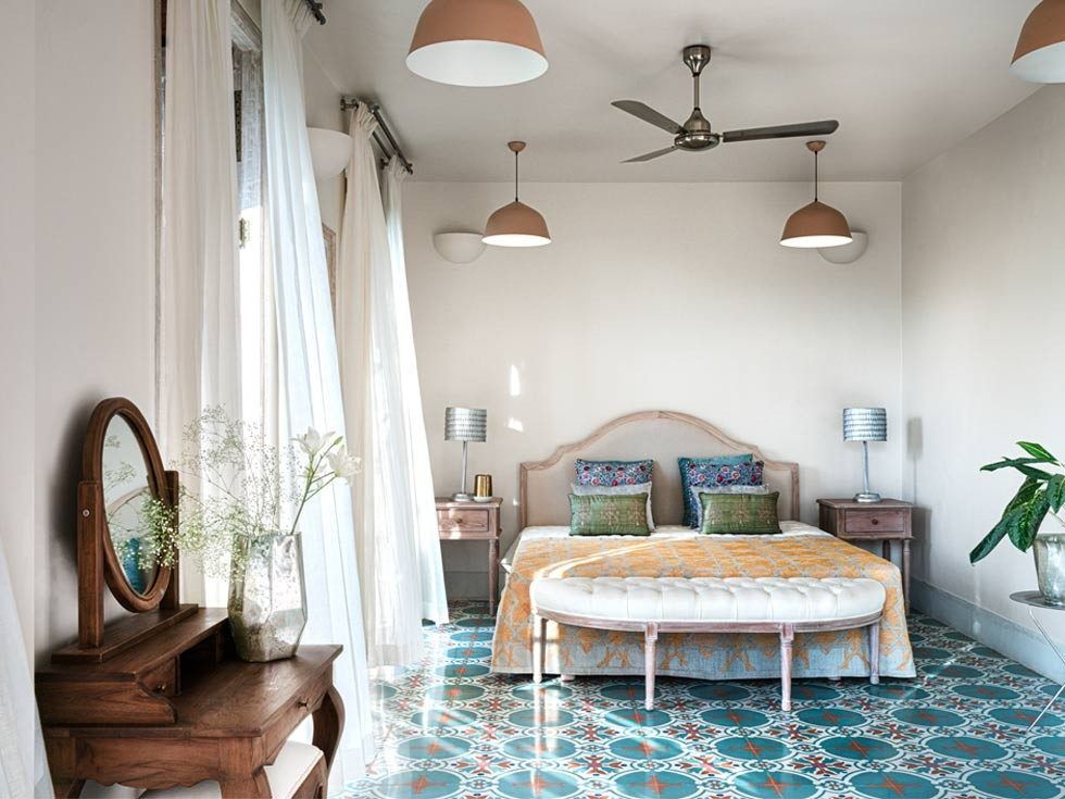 The Japanese postcard artwork on the wall along with the bespoke floor lamp are sourced from The Flame Store, Goa – Beautiful Homes