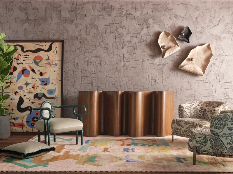 Tactile interior with human-centered design, Embrace Chair, rug, and console – Beautiful Homes