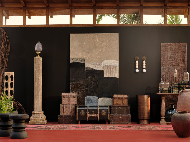 Pastoral interior with sculptural forms, rugged textures, rugs, wall art, and bronze table – Beautiful Homes