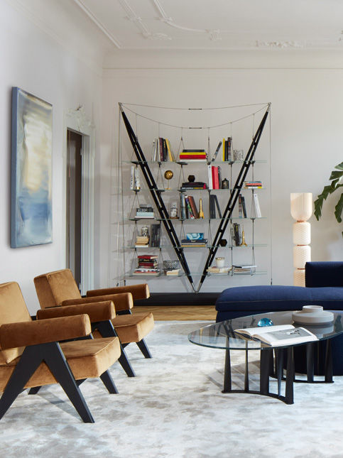 The Valiero bookcase uses wooden uprights, brass joints and tension cables to suspend glass shelves - Beautiful Homes