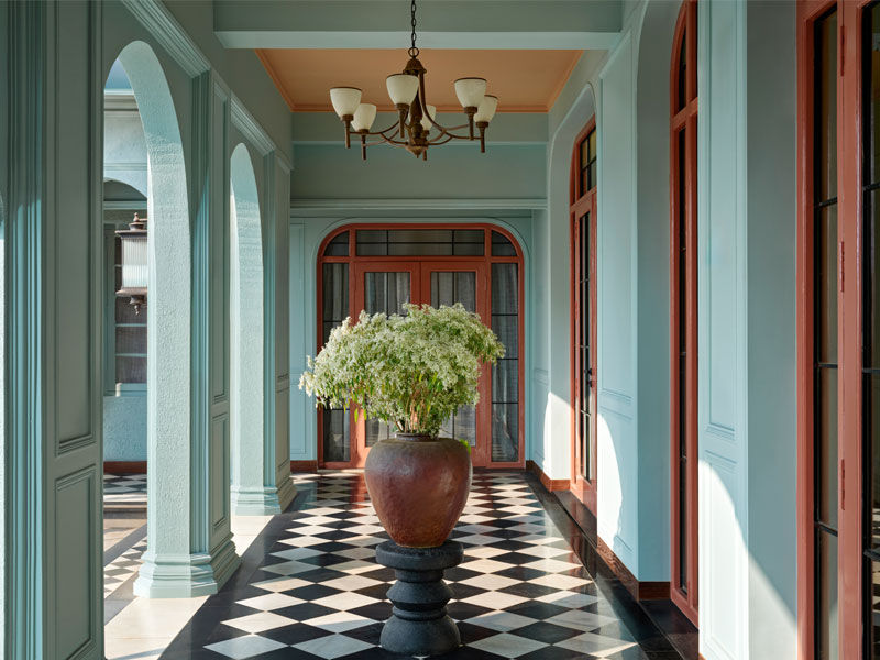 Interior with checks and stripes in warm, grounded palette – Beautiful Homes
