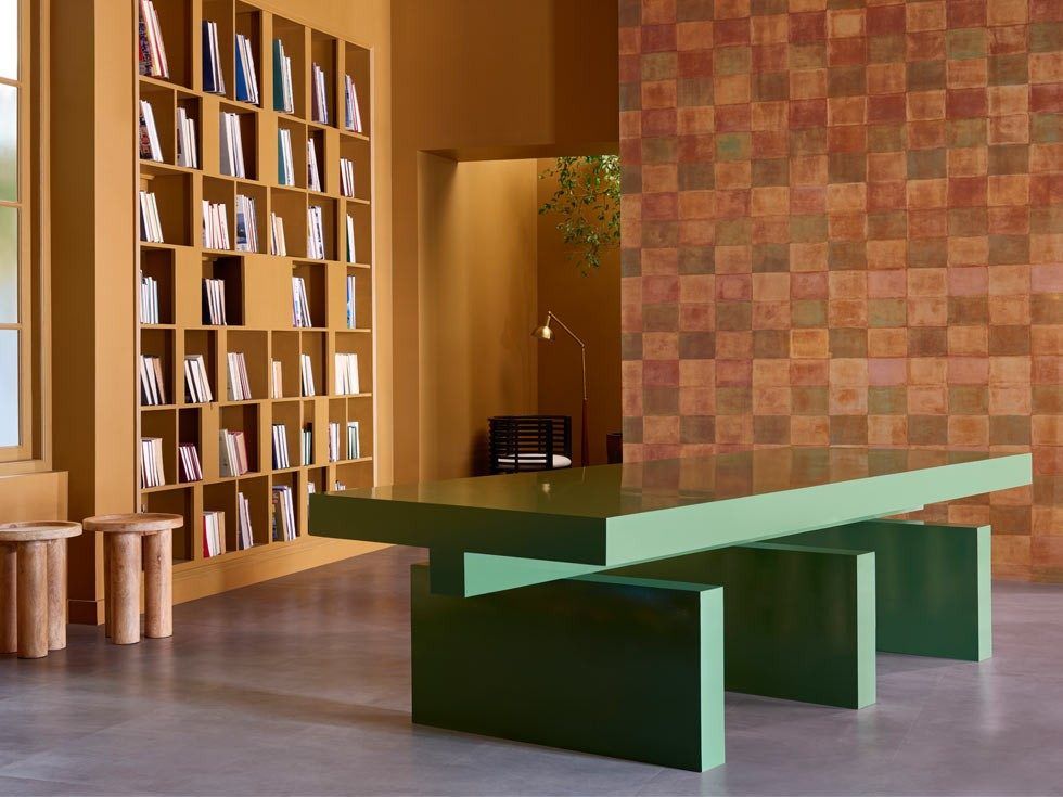 Study room with wallpaper, tall bookshelf and green table – Beautiful Homes